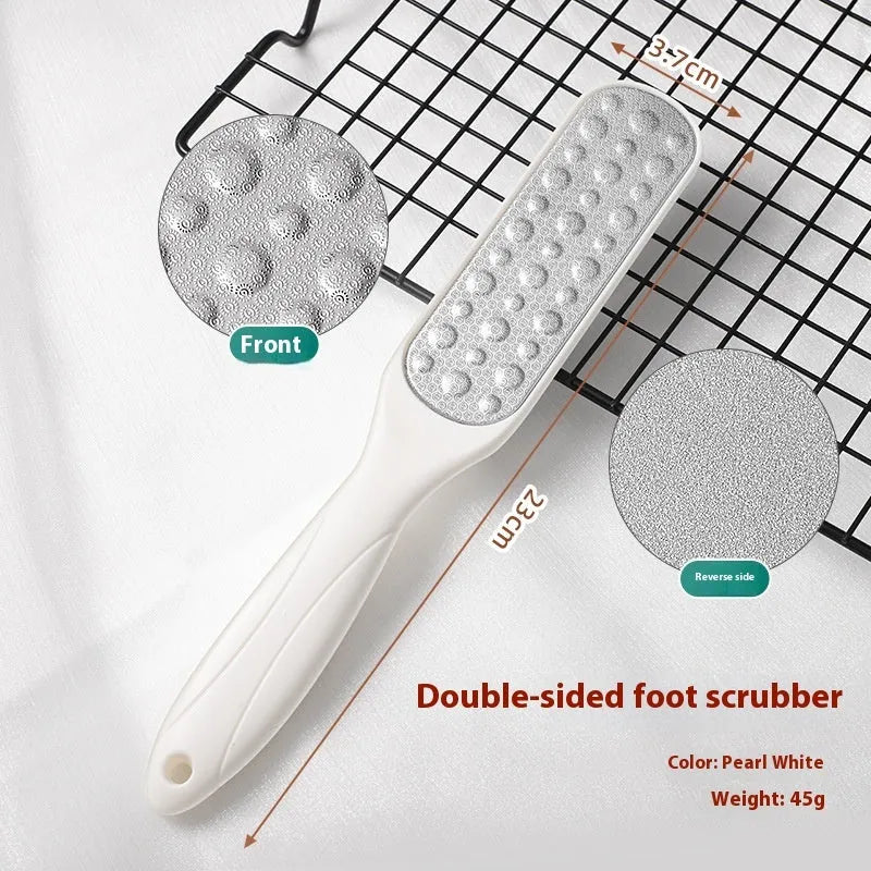 Stainless steel foot grinder file with attached sandpaper pad and separate black and white refill packs.