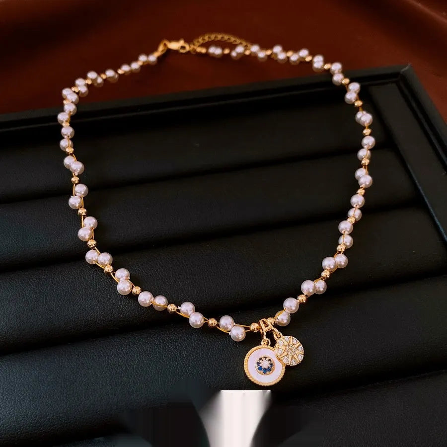 Gold electroplated zircon pearl round pendant necklace on clavicle chain with Chinese style design