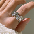 Silver geometric open ring with three-dimensional decoration and cross zircon design