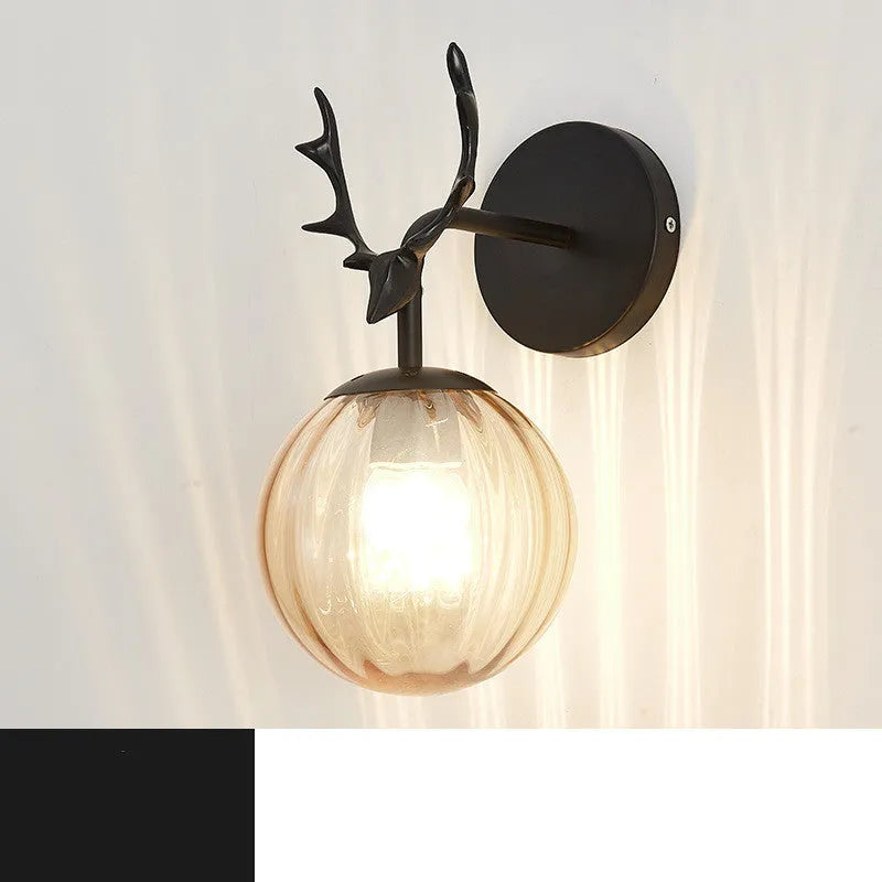 Modern round glass wall sconce with a Nordic design, mounted on a white wall, showing its light-diffusing shade and compact 30cm diameter.