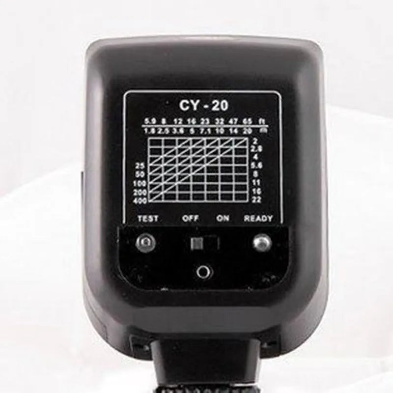 Compact silver hot shoe camera flash unit with head tilted upwards, shown on a camera.