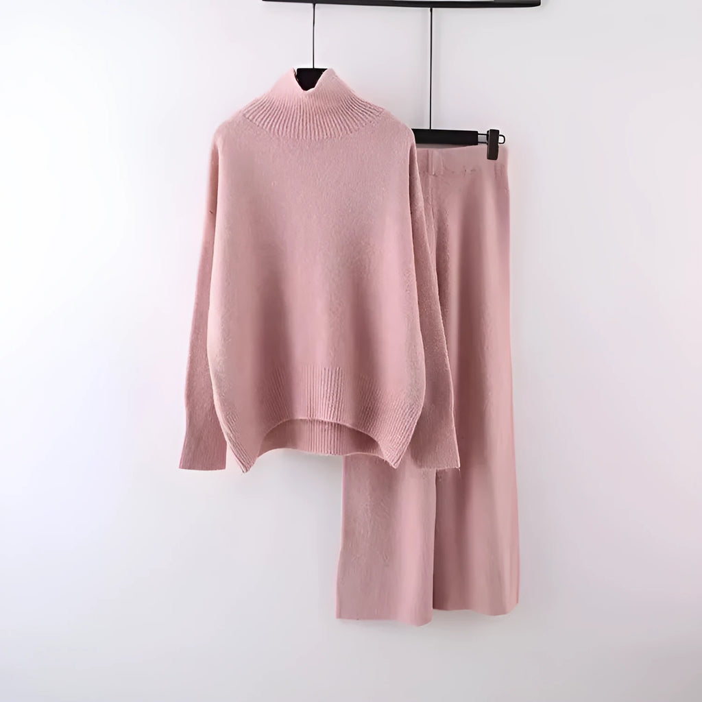 Women's milky white acrylic two-piece set with long sleeve top and wide-leg trousers on a hanger.