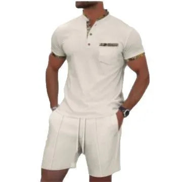 Man wearing a grey waffle knit zip-up polo collar top and matching shorts from a two-piece summer suit.