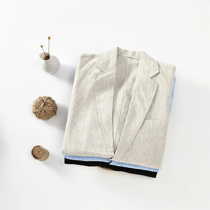Men's thin solid colour linen coat with stick pockets on a hanger.