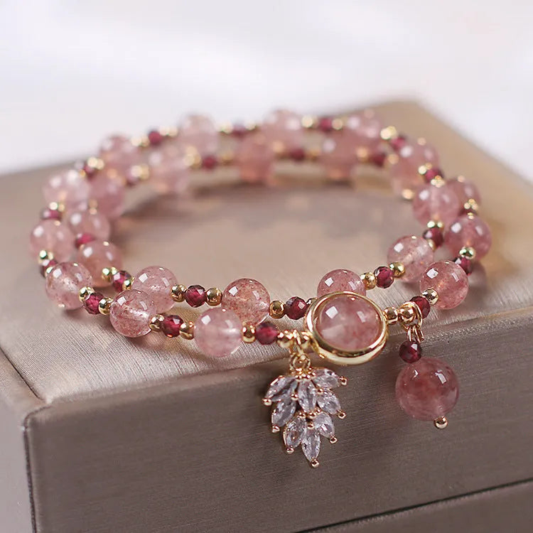 Women's double layer crystal bracelet with lucky cat charm and red cat's eye flowers in ethnic fairy style.
