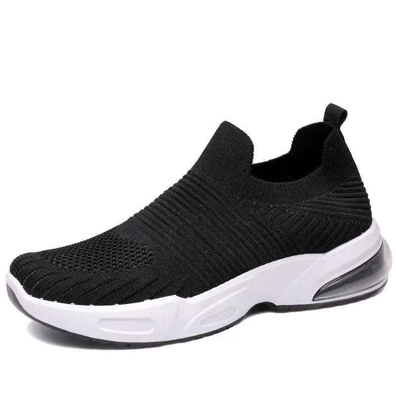 Lightweight black slip-on sock shoes with a low-top design and textured PVC sole.