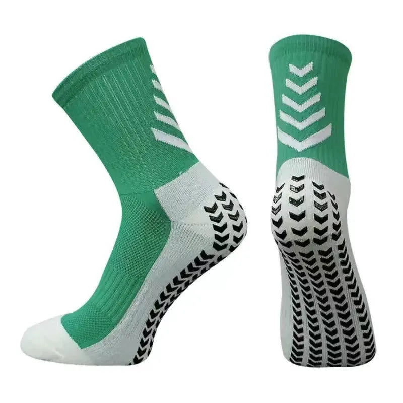 Men's black and green mid-calf athletic socks with a geometric pattern and non-slip silicone grip.