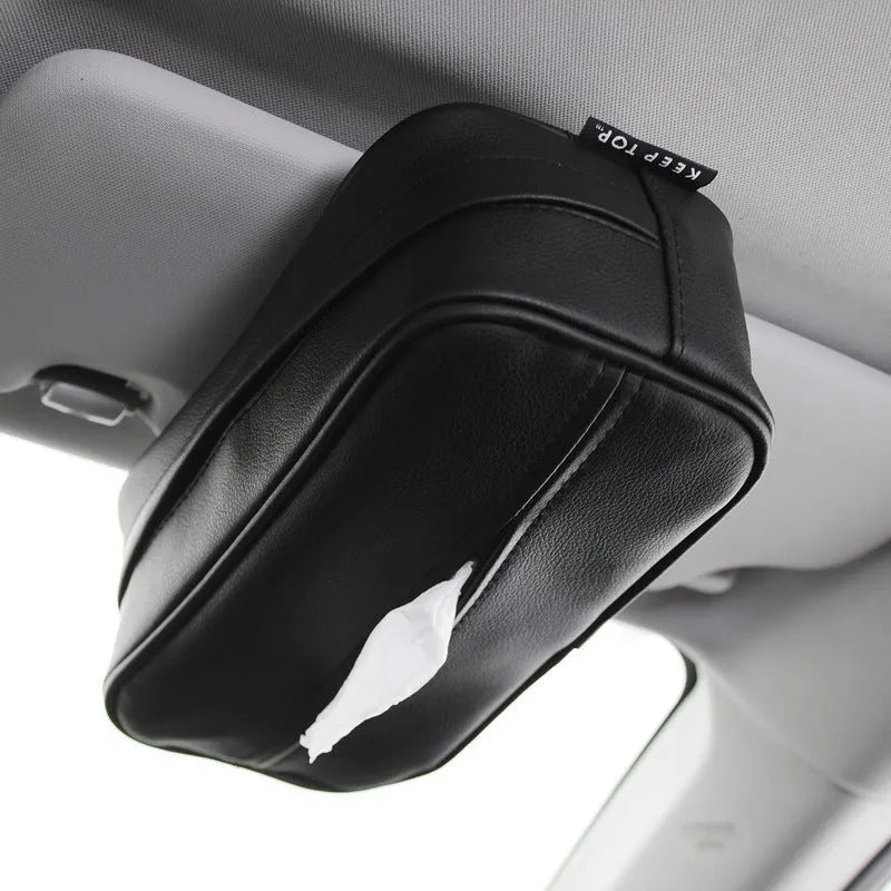 Black PU leather car hanging organiser bag with paper insert for storing documents.