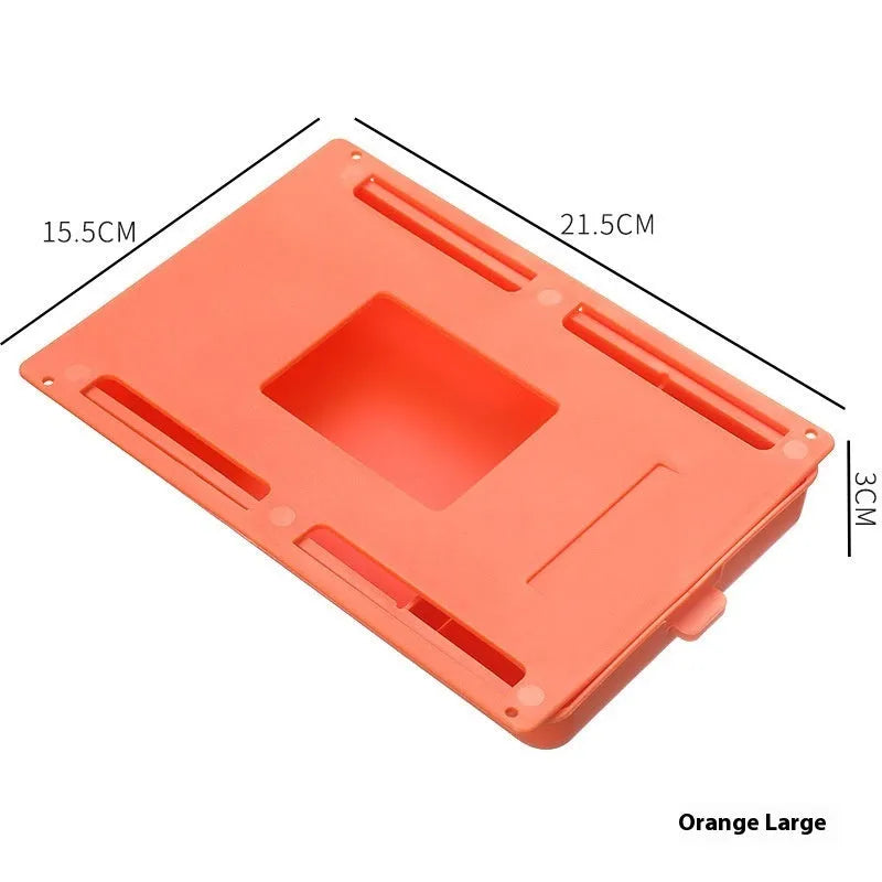 White plastic storage drawer with a cover and internal grid compartments, shown mounted underneath a wooden table.