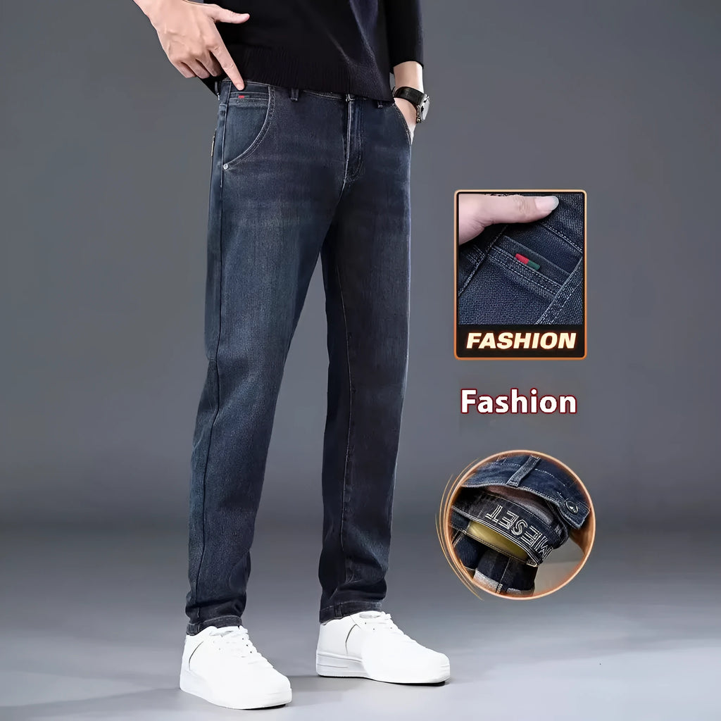 Man wearing blue-grey slim straight loose fit casual trousers with a micro-elastic waist.