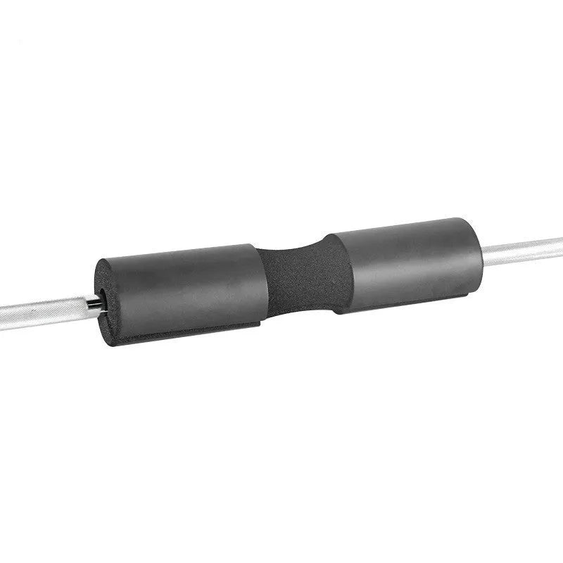 NBR foam barbell shoulder pad 44cmx10cm in black on a barbell with weight plates, for squats and hip thrusts