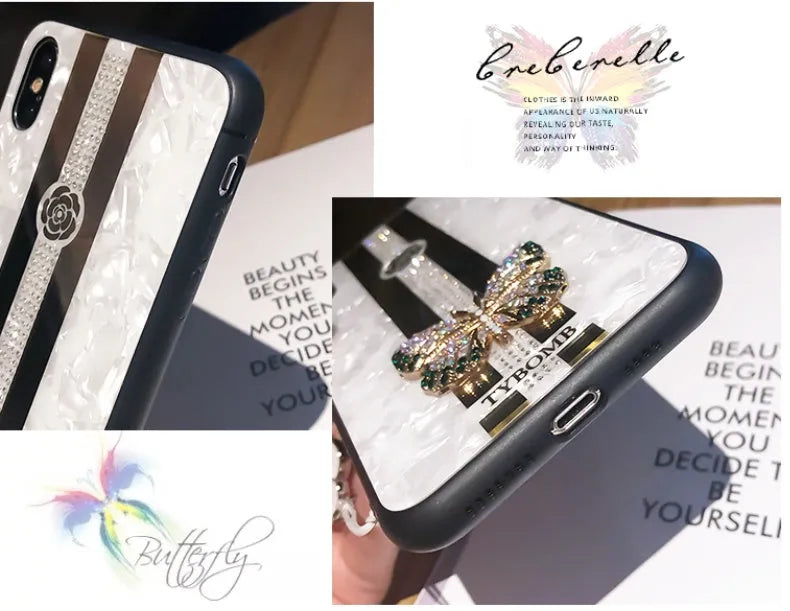 Luxury acrylic iPhone case with crystal butterfly design and mirror back, shown in purple.