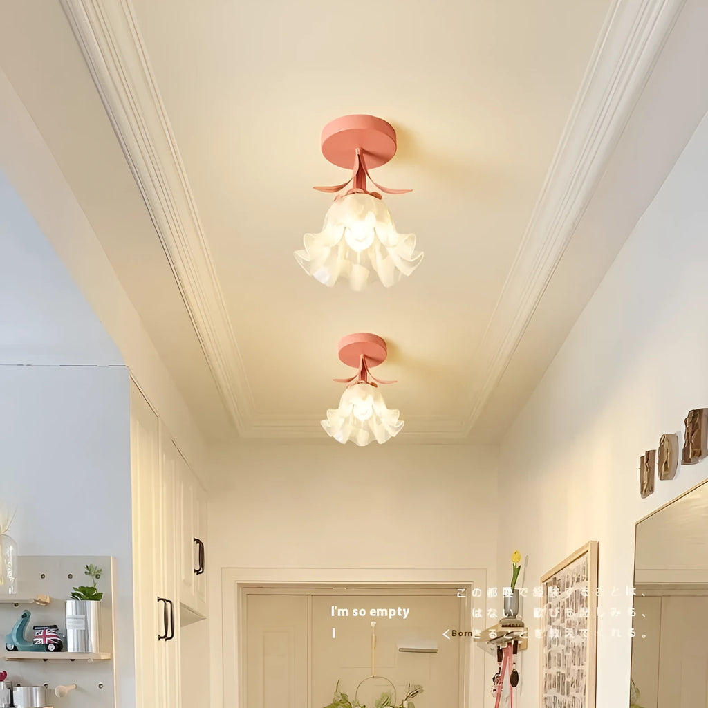 Cream coloured Linglan flower inspired corridor wall light with modern simple design on a white background.