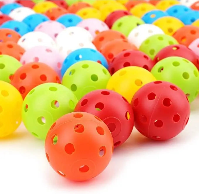 Multi-coloured 42mm golf practice balls with dimpled design in a net bag.