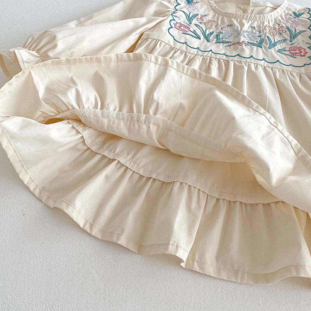 Girls' ruffled long sleeve flower embroidered princess dress in apricot colour on a child model