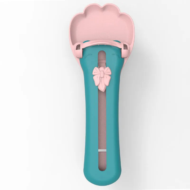 Green and pink pet feed spoon with extrusion design and squeezer feeder function for cat treats and liquid foods