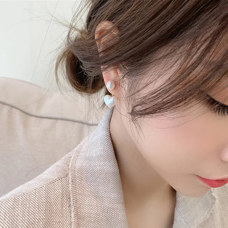 Women's heart-shaped pearl stud earrings with Korean style design and electroplated alloy construction