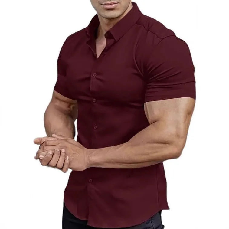 Man wearing a brown short sleeve printed casual shirt with a collar.
