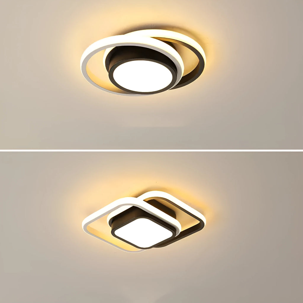 Modern round aluminium ceiling light with integrated LEDs, shown illuminating an entrance hall.