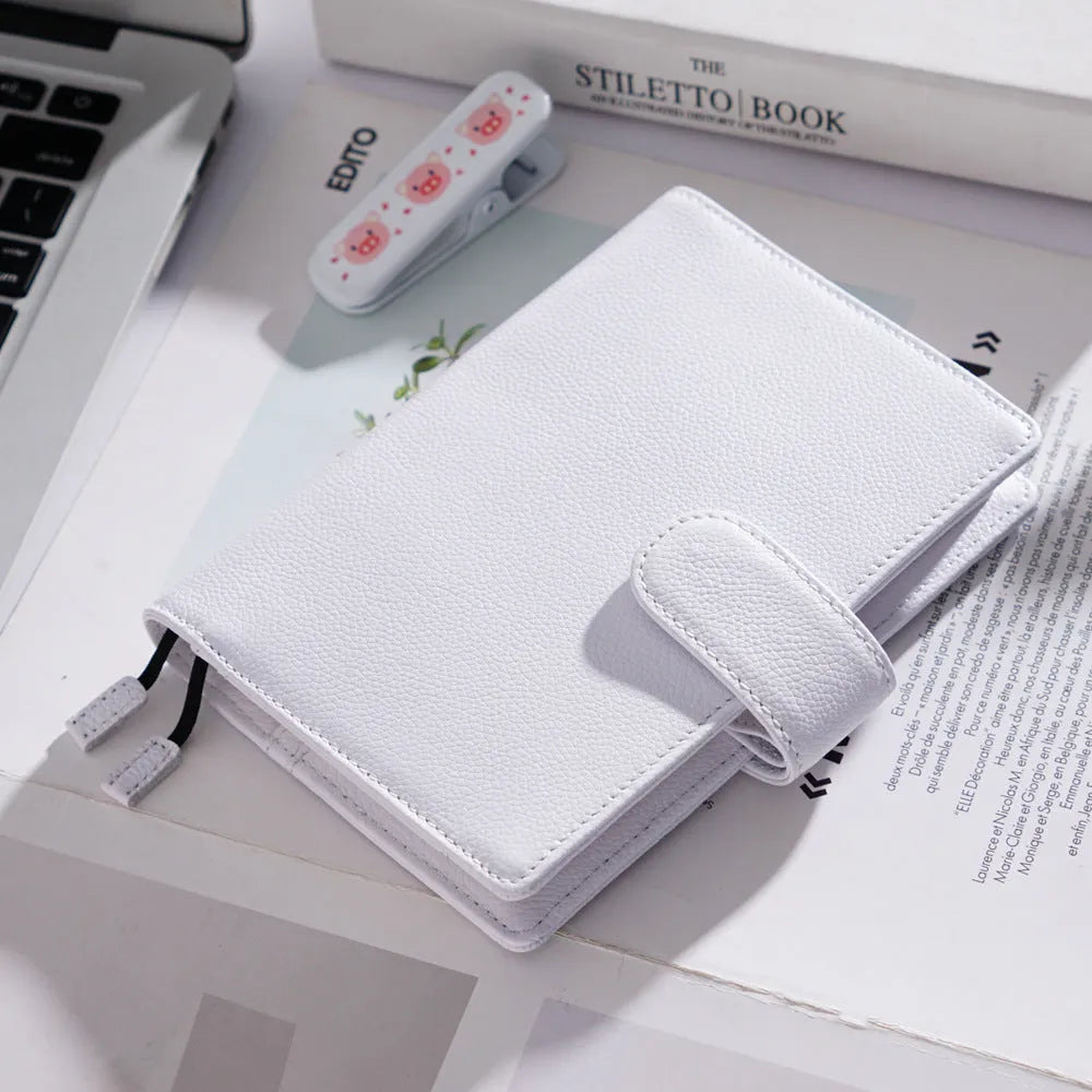 A6 loose-leaf diary with cowhide leather cover showing lychee pattern texture
