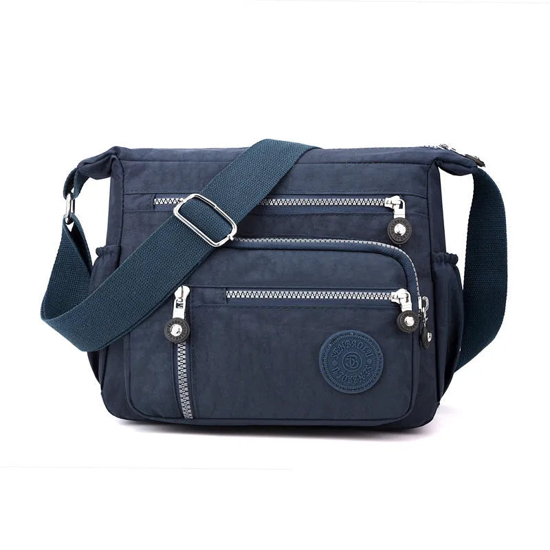Soft nylon messenger bag in square vertical shape with single shoulder strap