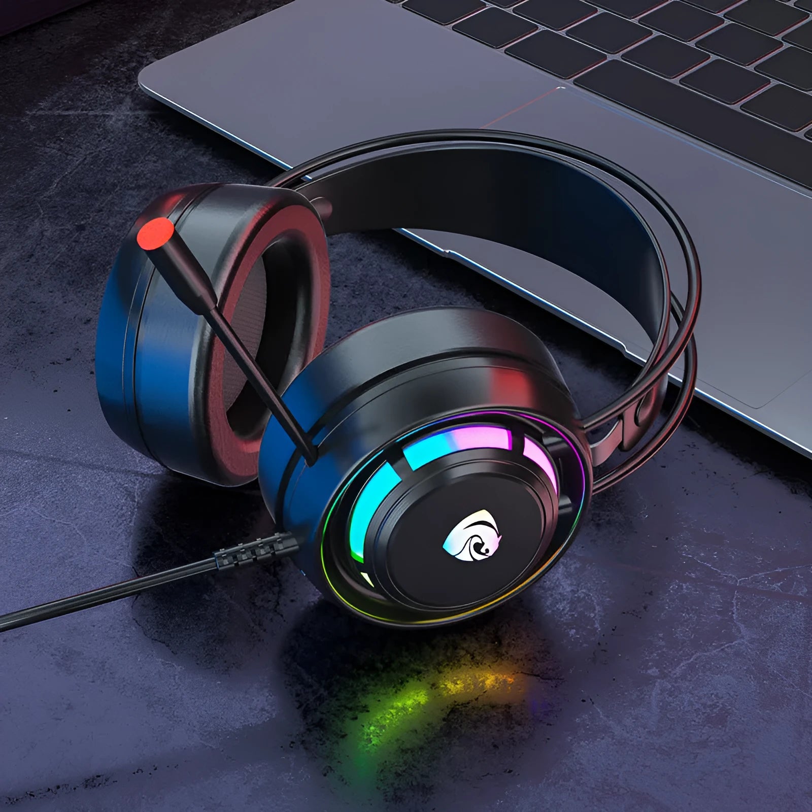 Black wired computer headphones with microphone, showing over-ear design with sponge cushions and a long cable.