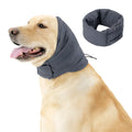 Dog wearing black calming hoodie covering ears with multi-purpose design for noise reduction and hair management