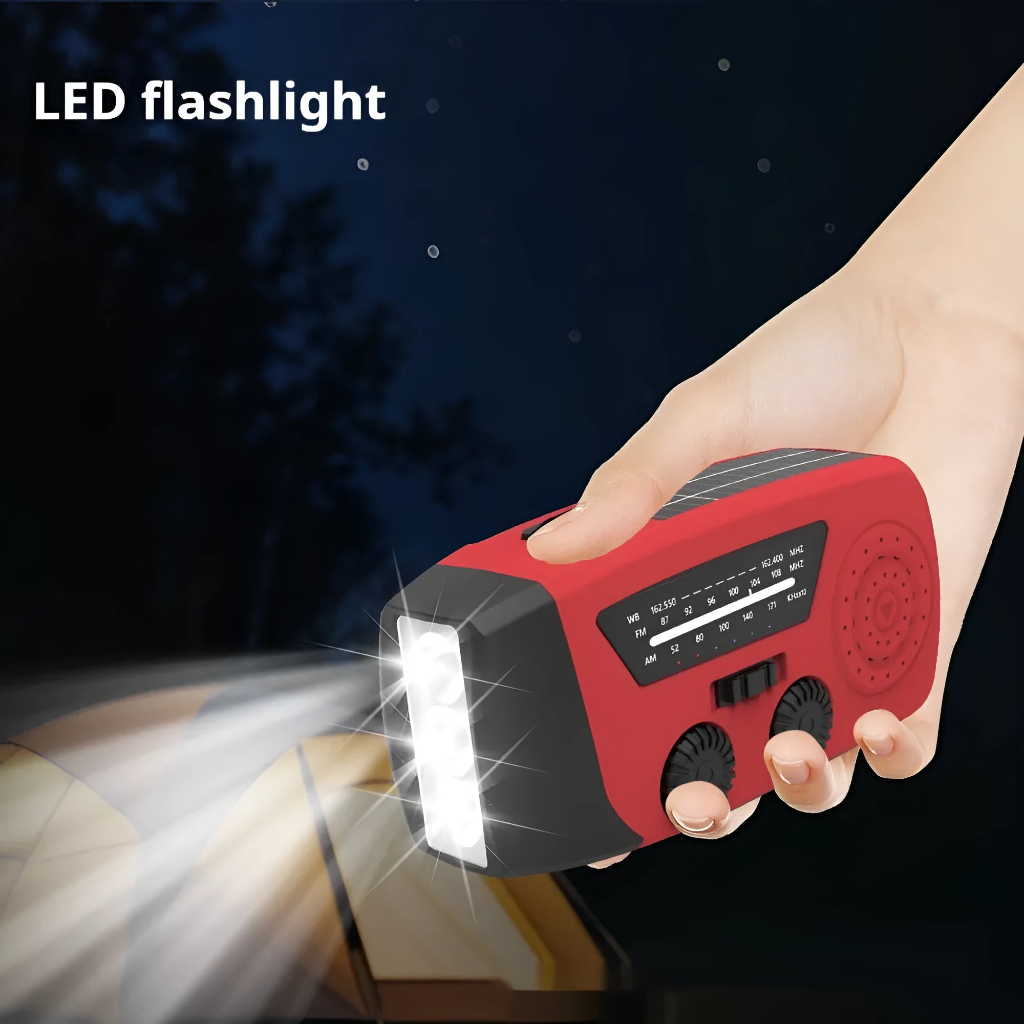 Red rechargeable hand-held emergency radio torch with wrist strap and USB charging port.