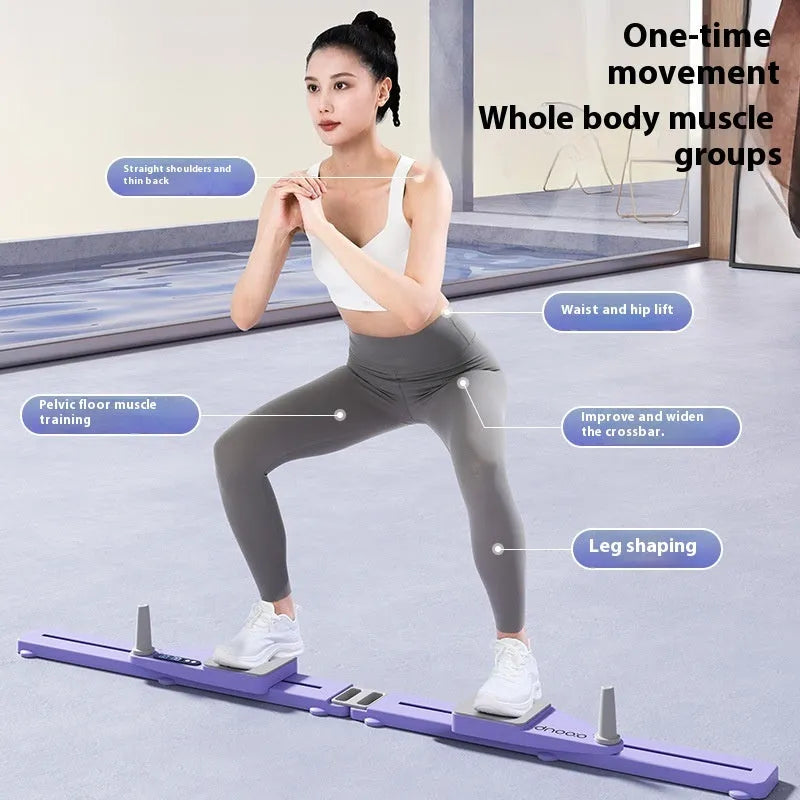 A compact purple split skiing machine trainer folded on a wooden floor, showing its 85cm length and PP construction.