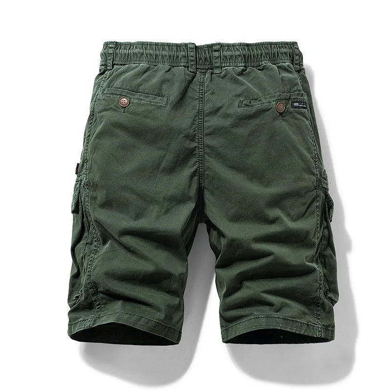 Men's army green cotton shorts with zipper and multiple pockets, shown in a Korean style fit.