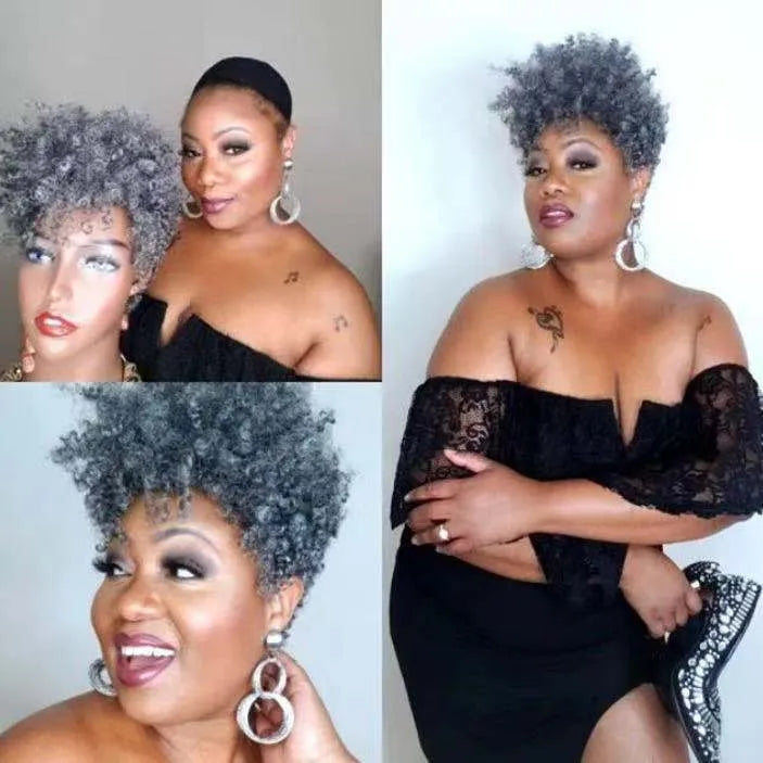 Short black synthetic wig with simple rolled hairstyle, made from Kanekalon fibre.