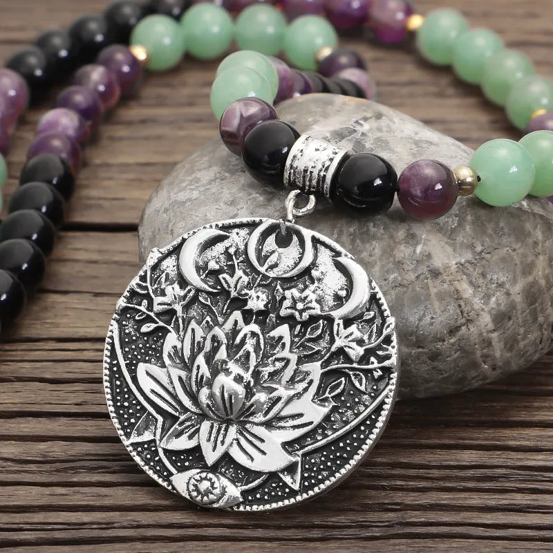 Dongling long necklace with geometric lotus pendant and adjustable cord alongside matching bracelet