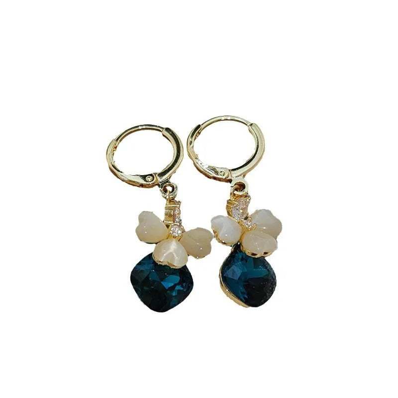 Women's blue crystal earrings with real gold plating bow shape and three-leaf flower motif