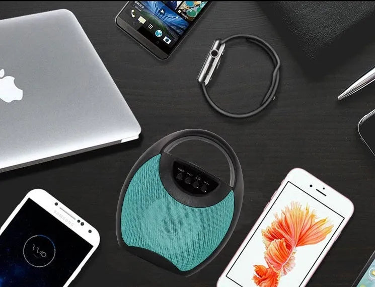 Portable Bluetooth speaker in black, blue or pink colours showing USB port for U disk or SD card playback