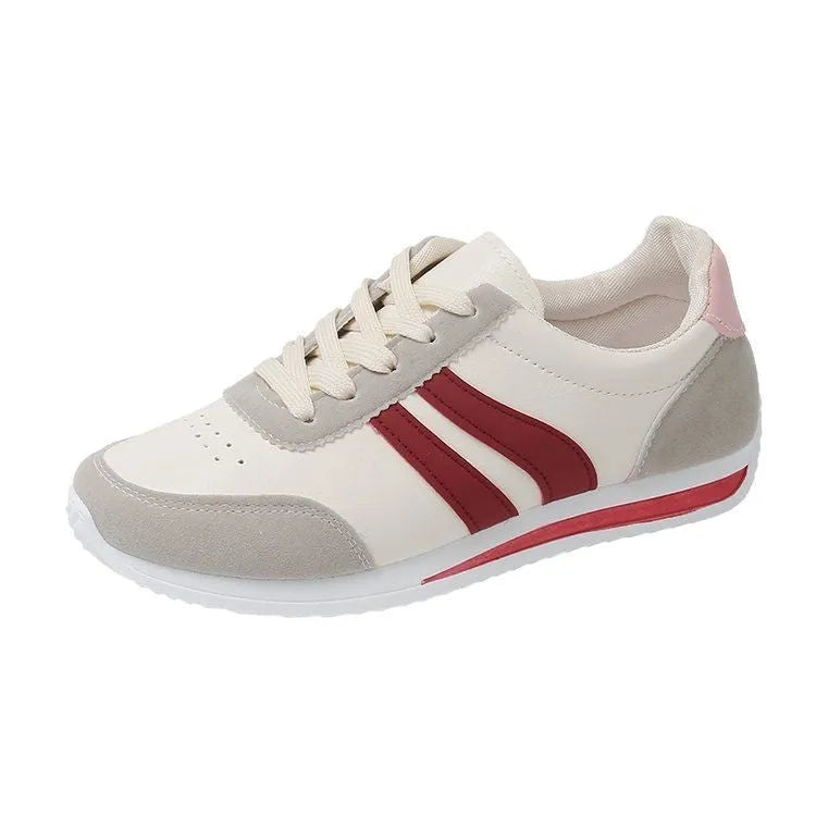 Blue and red low-top lace-up running sneakers with rubber soles and mesh upper