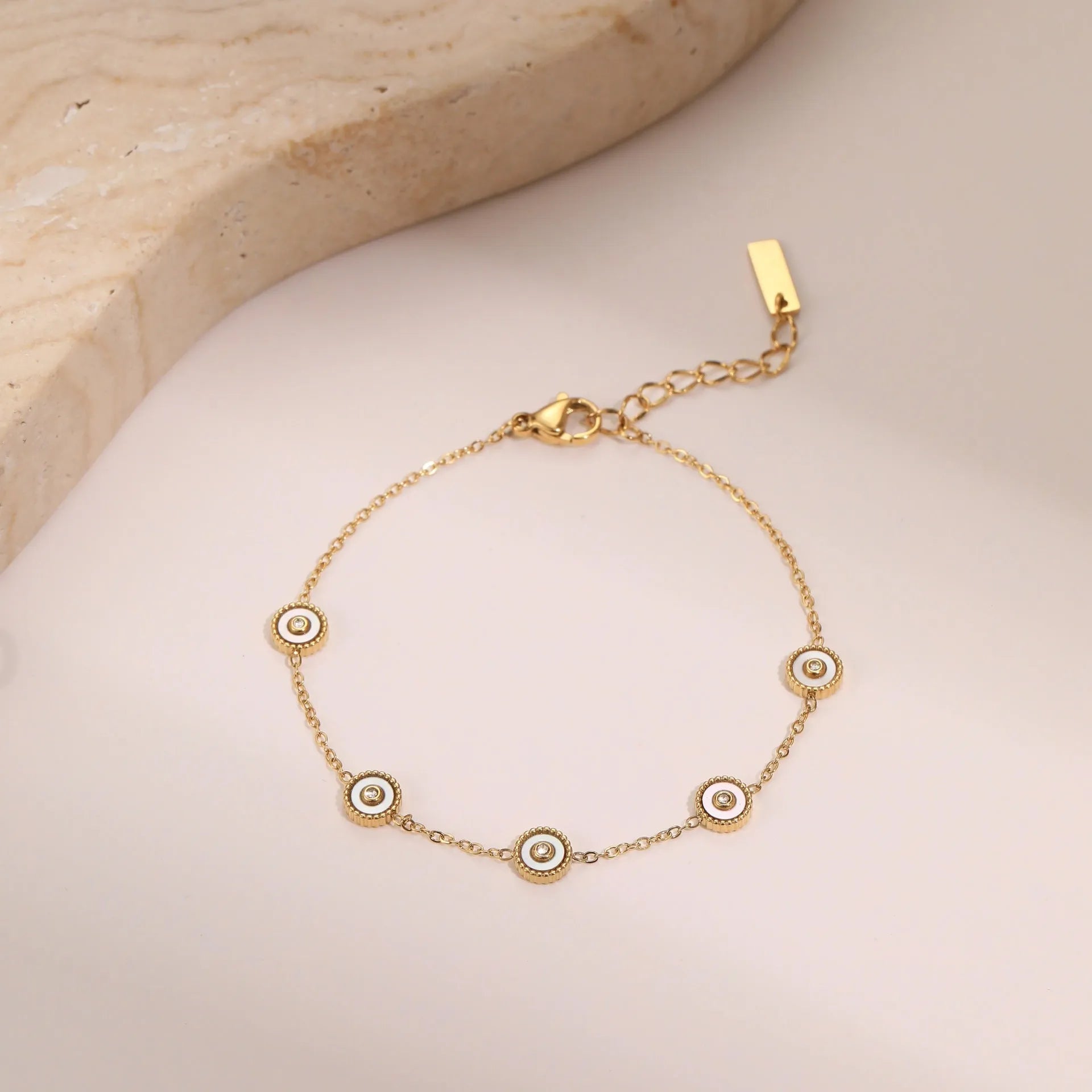 Gold-plated geometric fritillary design stainless steel bracelet and necklace set for women.