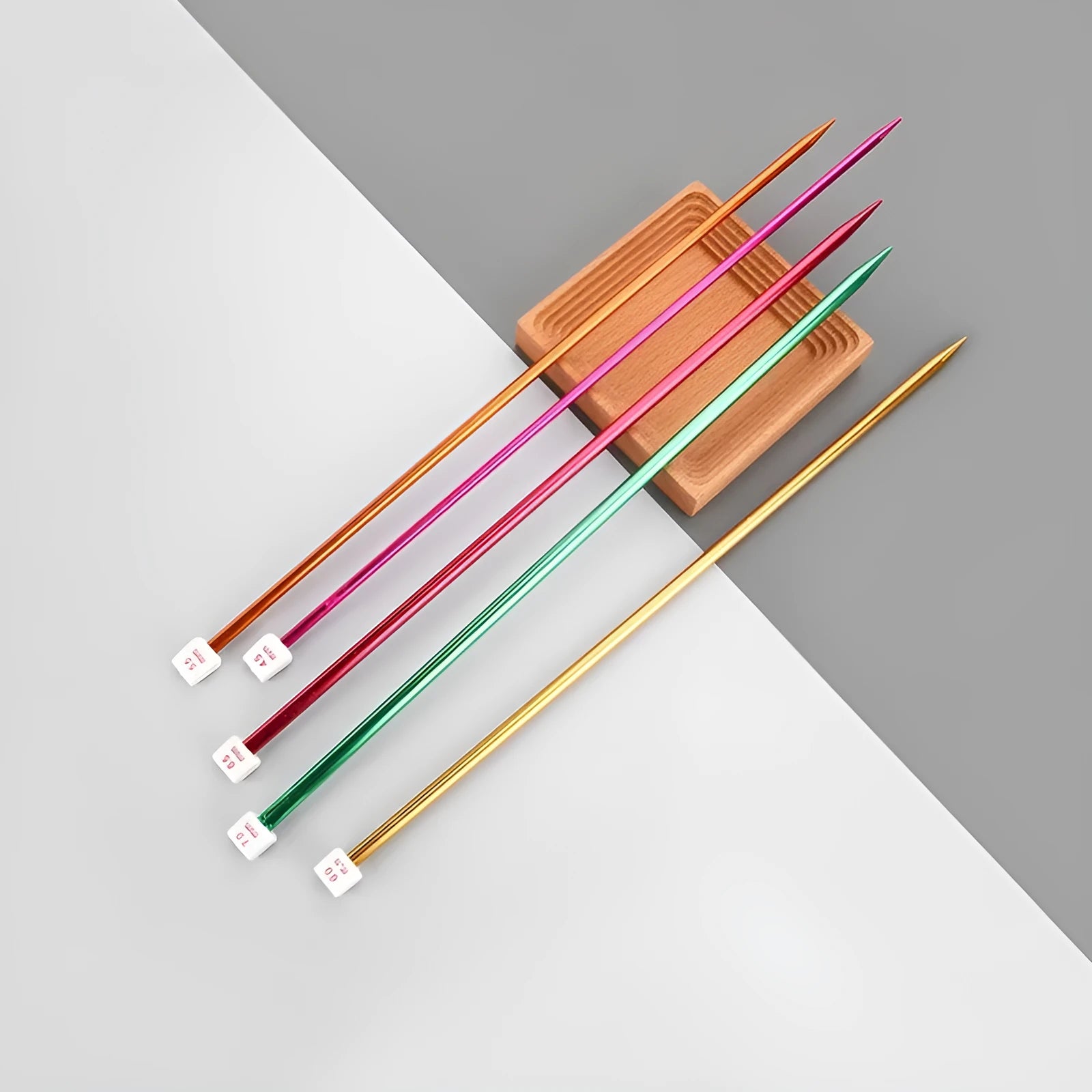 Lengthened crochet hook set showing multiple sizes from 2.0mm to 10.0mm, each with a protective cap.