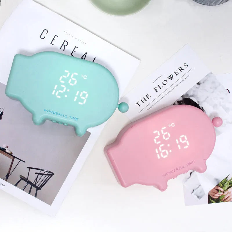 Blue and pink multifunctional LED alarm clock showing time, temperature, and a USB charging port.