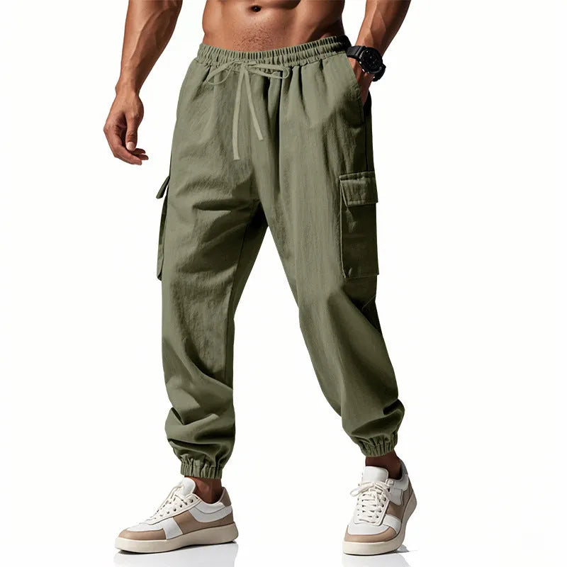 Men's linen casual trousers with ankle-tied cuffs and multiple pockets in a solid colour.