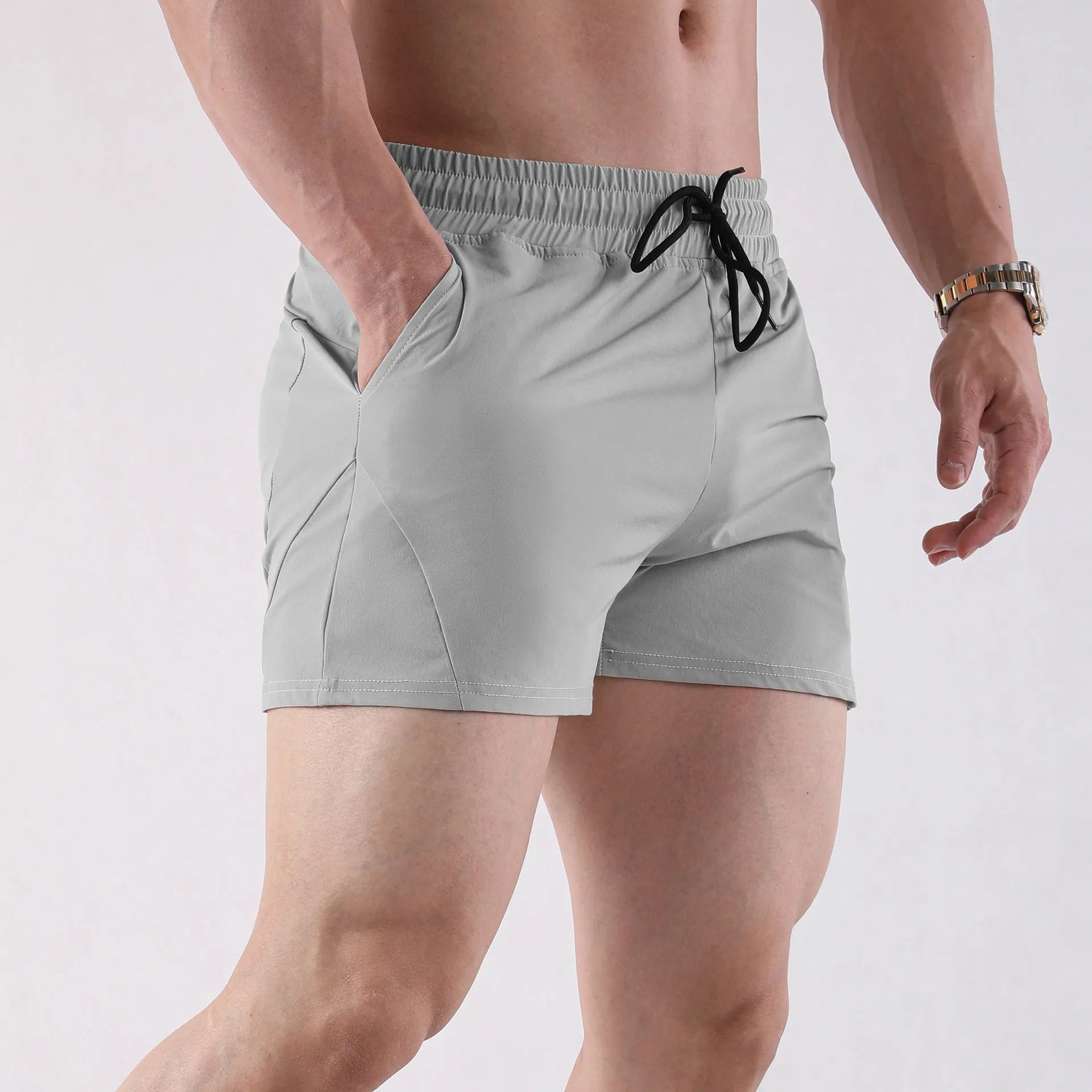 Men's lightweight polyester basketball shorts in grey, shown for summer sports wear.