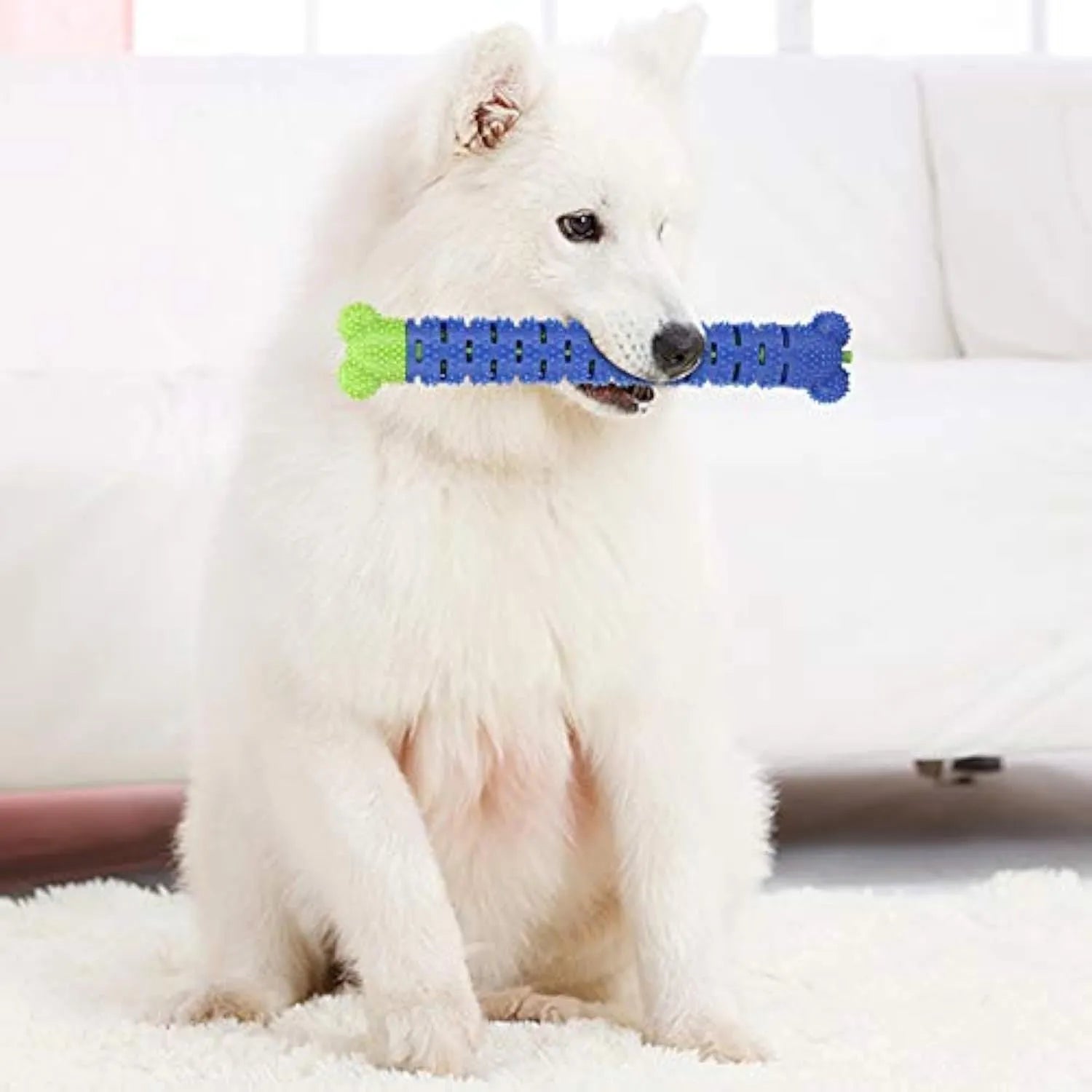 Blue silicone dog chew toy with textured brush head design for dental cleaning.