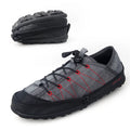 Orange folding outdoor hiking shoe with mesh upper and side zip closure laid flat.