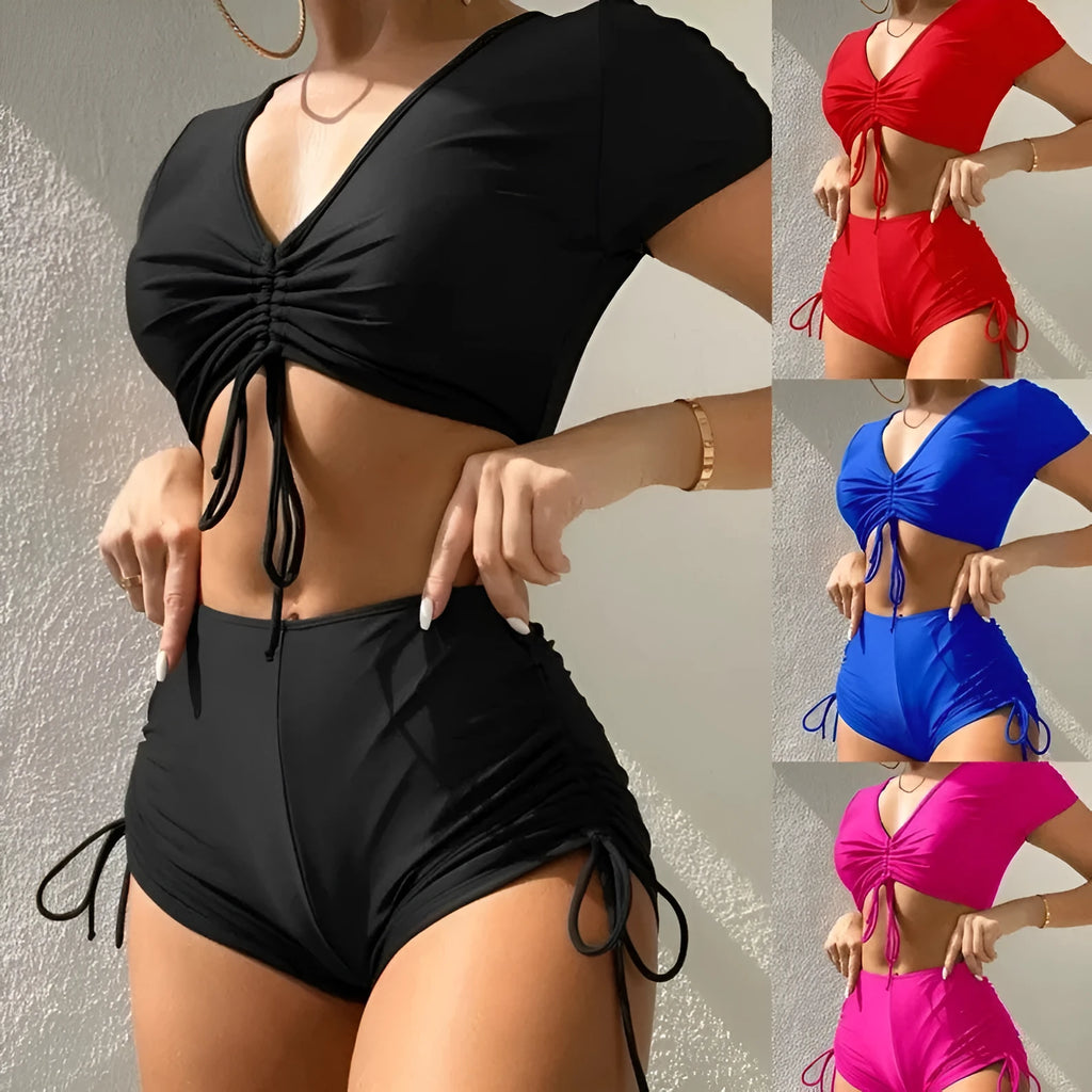 Women's lace-up front swimsuit top with matching shorts in dark green.