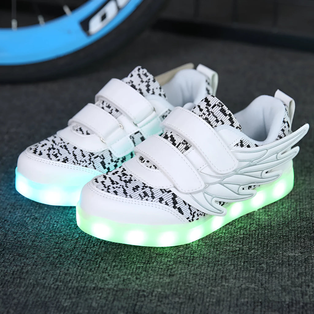 Children's plum red and white LED light-up trainers with USB charging port on the side.