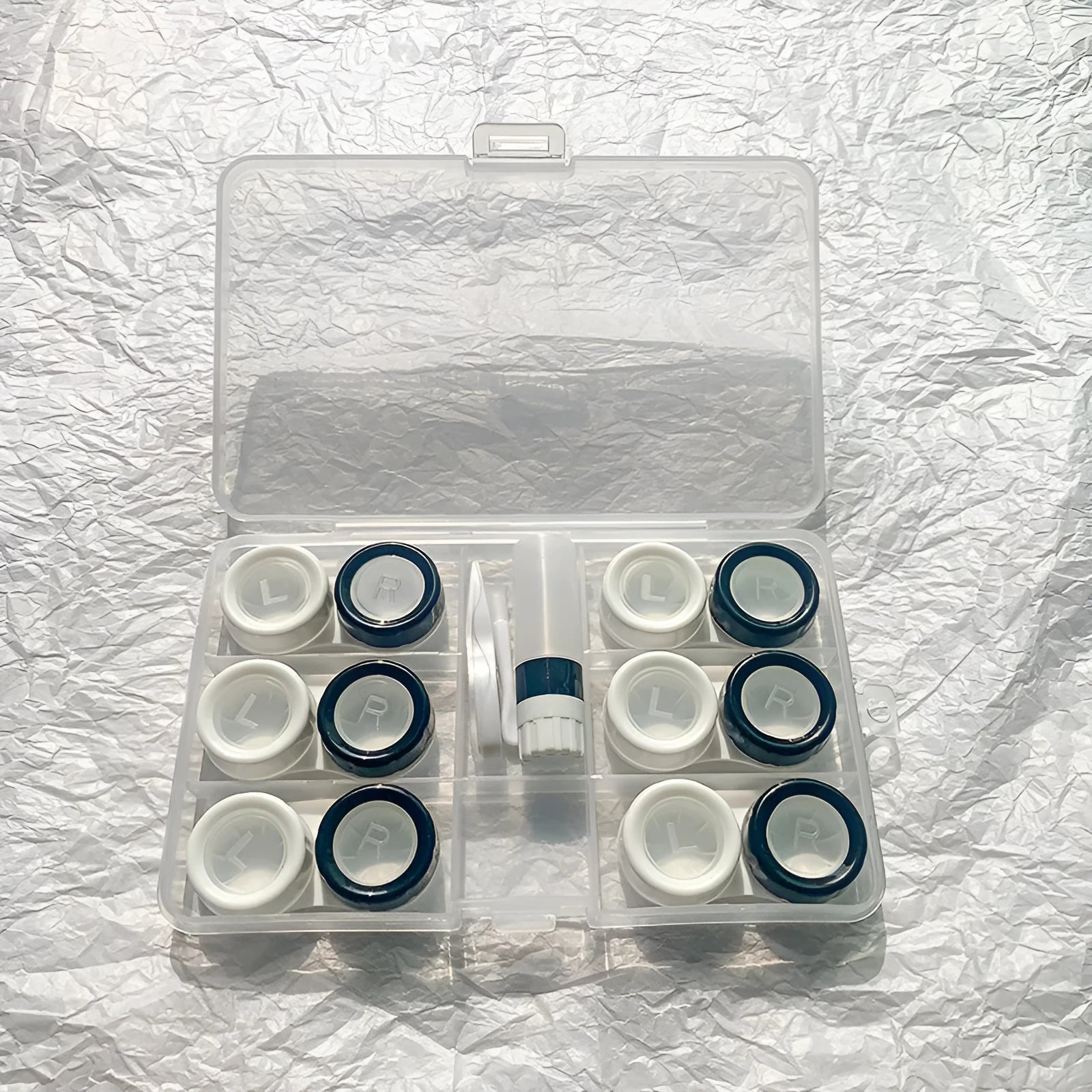 Rectangular contact lens case in various colour combinations including black white and pink white