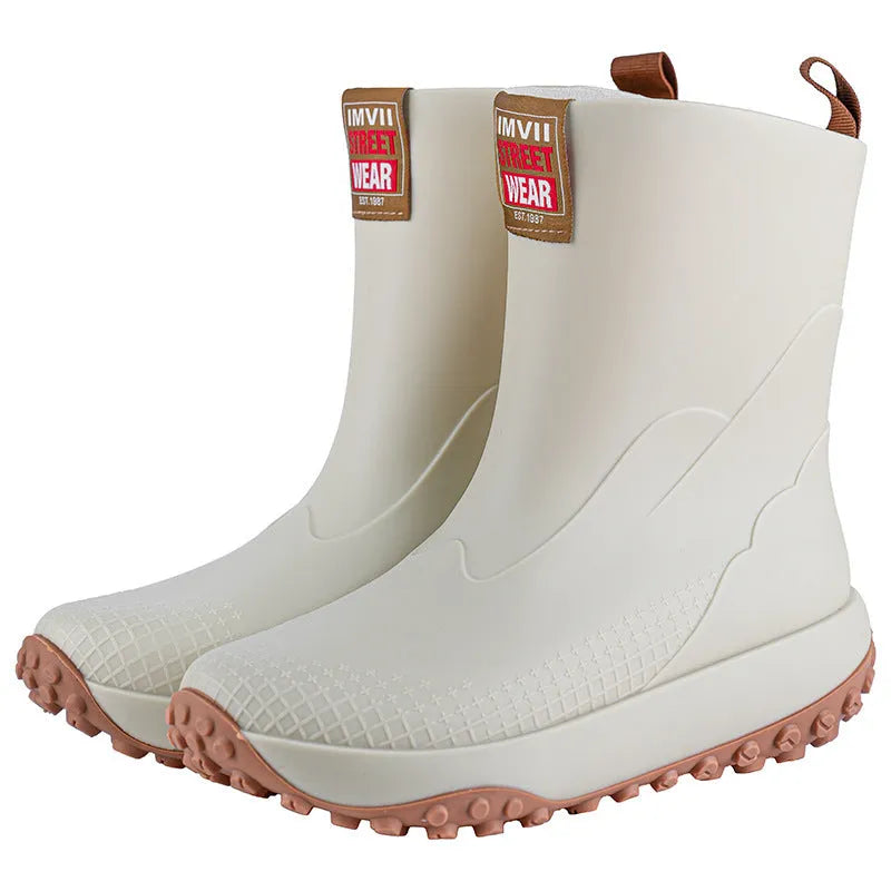 Men's mid-height PVC rain boot in beige colour with a round toe and plastic sole.