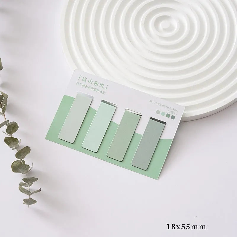 Set of four miniature magnetic bookmarks in soft Morandi series colour blocks on a white background.