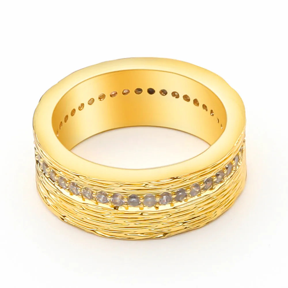 Gold geometric zircon ring for women on a white background, showing electroplated copper construction.
