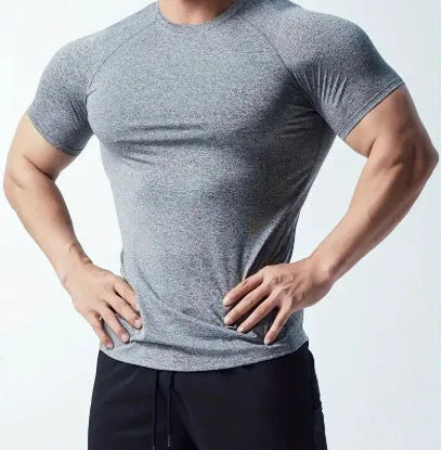 Man wearing a green quick-dry stretch polyester short sleeve t-shirt.