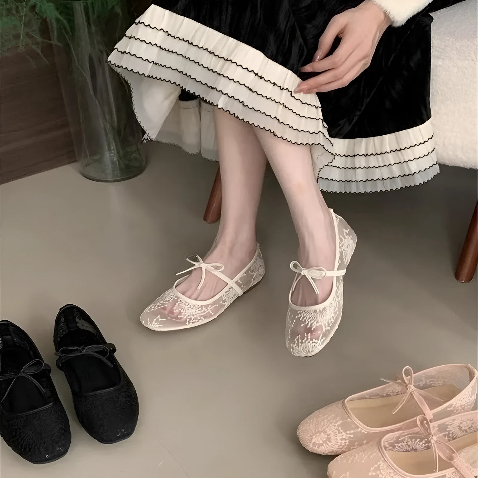 Pink flat heel Mary Jane evening shoes with lace mesh upper and rubber sole.